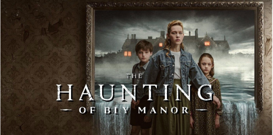 This photo features Miles Wingrave (left), the au pair, Dani Clayton (middle), & Flora Wingrave (right) standing in front of Bly Manor by their lake (Photo Courtesy of Screen Rant).
