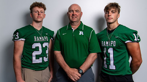 Pictured are Ramapo football captains Dylan Snee (left) and Jack Remo (right) alongside Coach Drew Gibbs (center)