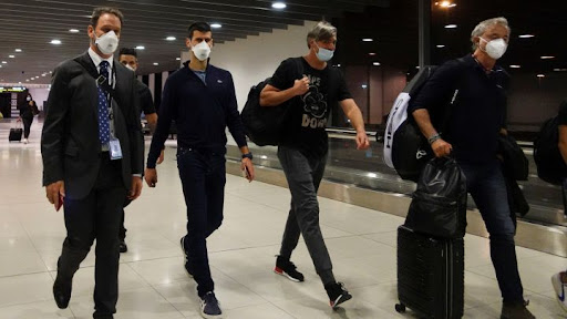 Novak Djokovic walking in Melbourne Airport after his visa was canceled.