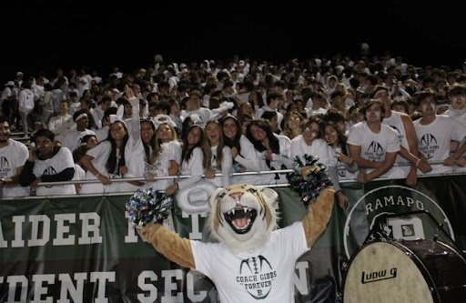 Seniors with the Raider Cat front row at the Drew Gibbs Memorial Service and White Out Game.