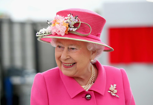 Queen Elizabeth II, resplendent in one of her iconically bright colors