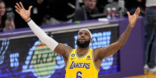 Lebron James celebrates after beating the scoring record held by Kareem Abdul-Jabbar. 

