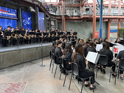 Pictures including the performance seating of the music department and a beach photo featuring the music department seniors. 
