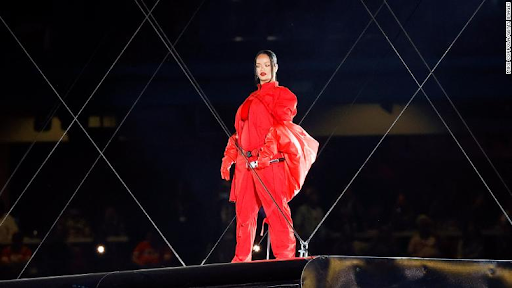 Rihanna standing on a floating platform beginning her performance at the
Super Bowl Halftime show. 