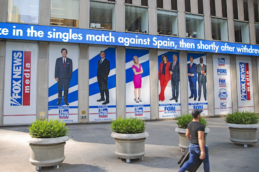 Banners of Fox News stars line News Corp’s New York City headquarters in 2021. 