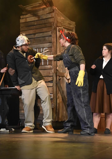 Mary Regan as Ms. Penelope Pennywise in Urinetown. Photo Source: Mrs. Fornasieri
