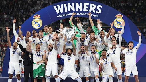 Real Madrid posing after winning the 2022 Champions League 