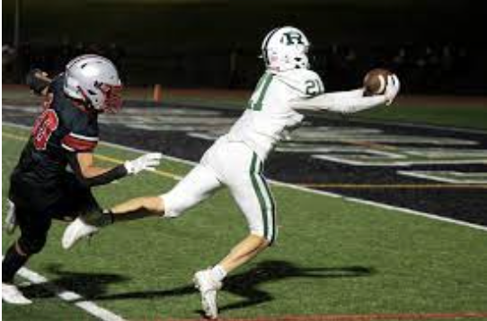 Gavin Taylor (#21) lays out to catch a game-winning hail mary pass to beat Somers