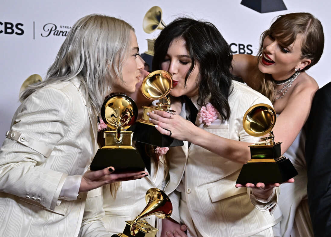 (From left to right) Phoebe Bridgers, Lucy Dacus, and Taylor Swift with their awards.