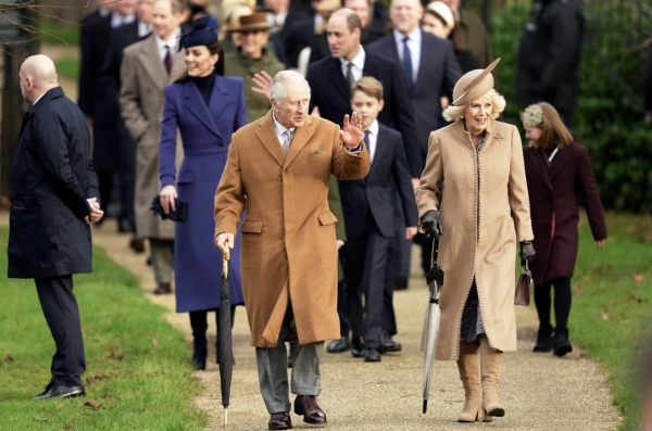 King Charles III walking with his wife, Queen Camilla, with other family members at Christmas Day services in 2022 at St. Mary Magdalene Church in Sandringham, Norfolk