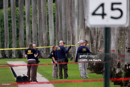 Law enforcement personnel on Sept. 17, 2024, investigating the area where the Secret Service discovered North (The Conversation)