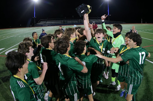 The Ramapo Varsity Boys Soccer team celebrates their fourth county win in a row  - Latronica in the bright green (NJ.com)