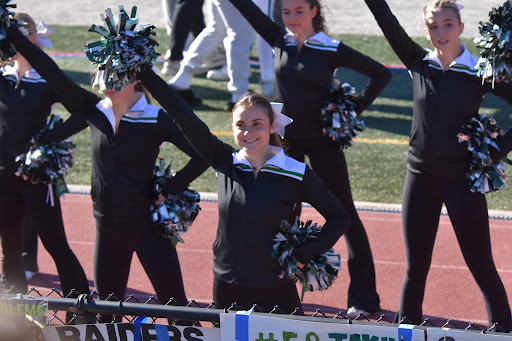 Avery cheering in front of the stands during a Ramapo football game. Source: Avery Orlando
