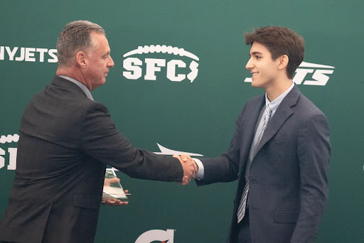 Super Football Conference president John Fraraccio (left) and Connor Pane (right) during the Steve DiGregorio Award presentation. Source: NJ.com
