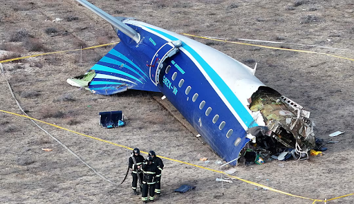 Azerbaijan Airlines flight J2-8243 is seen after the crash on its side with bullet holes after an accidental attack (Reuters)
