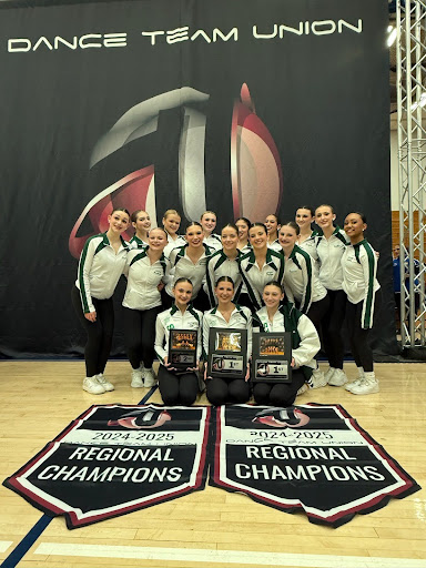 Ramapo Dance Team celebrates regional win with plaques and banners (Rachel Marsanico Daluz). 
