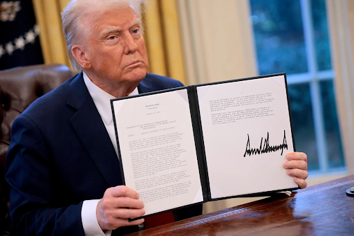 President Trump signing executive orders in the Oval Office (Chip Somodevilla/Getty Images)
